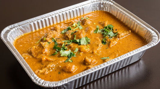 Chicken Achari (tangy pickle-spiced chicken curry) catering tray from Arun's Indian Kitchen
